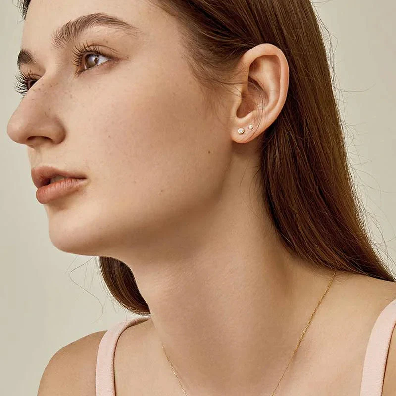 18K Gold Petite Delicate Diamond Stud Earrings - Image 2